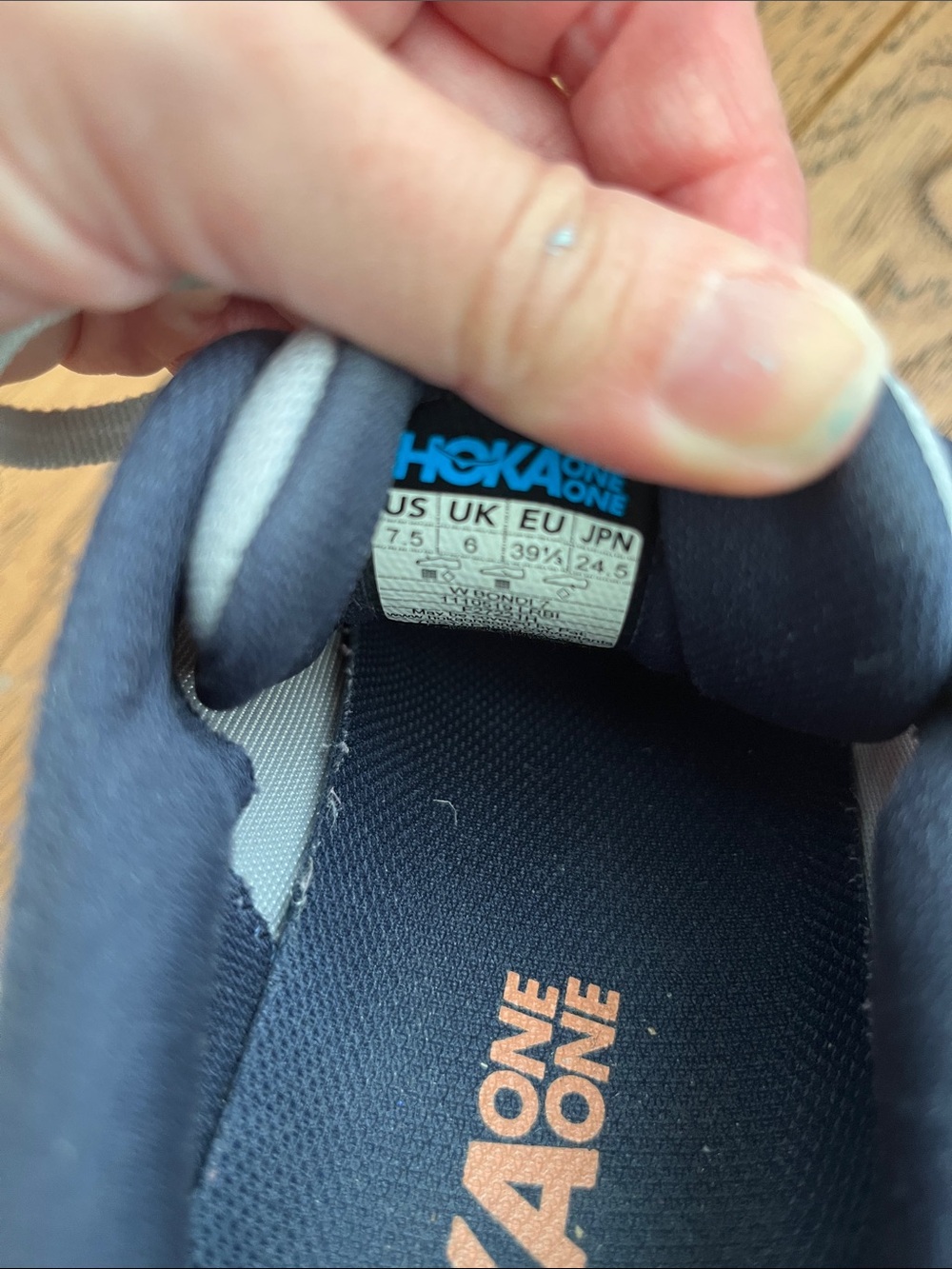 Hoka Bondi 7 woman’s Running Shoes in Light Gray with Navy and Orange Accents - Picture 4 of 4